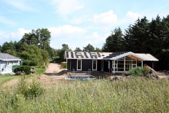 Gr�nne feriehuse hitter hos turister