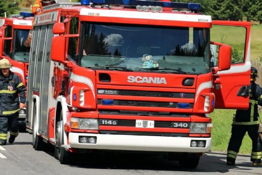 Naturbrand bag kirkeg�rd i Nex�